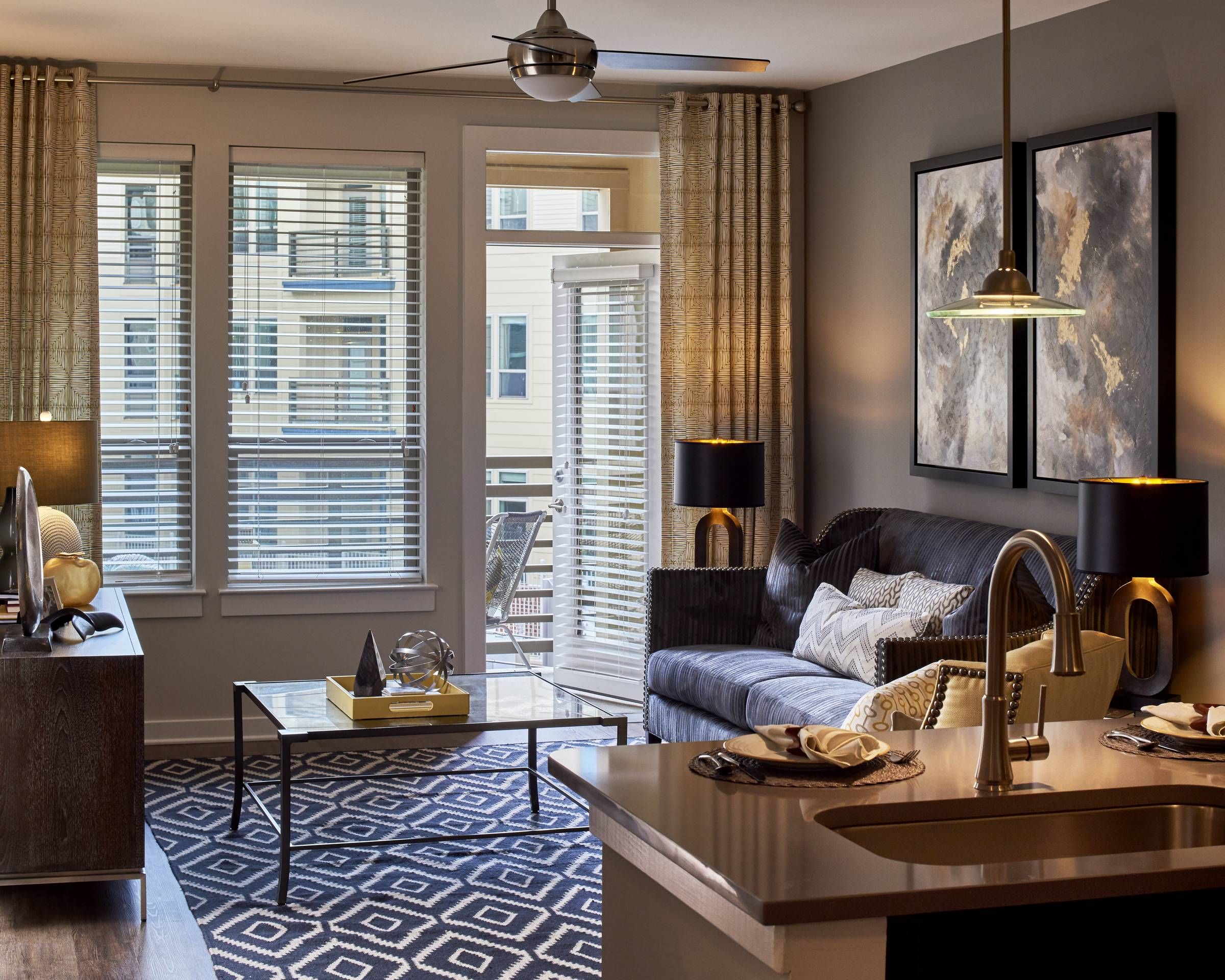 Evolution at Towne Center Laurel resident living area and kitchen looking out to private balcony.